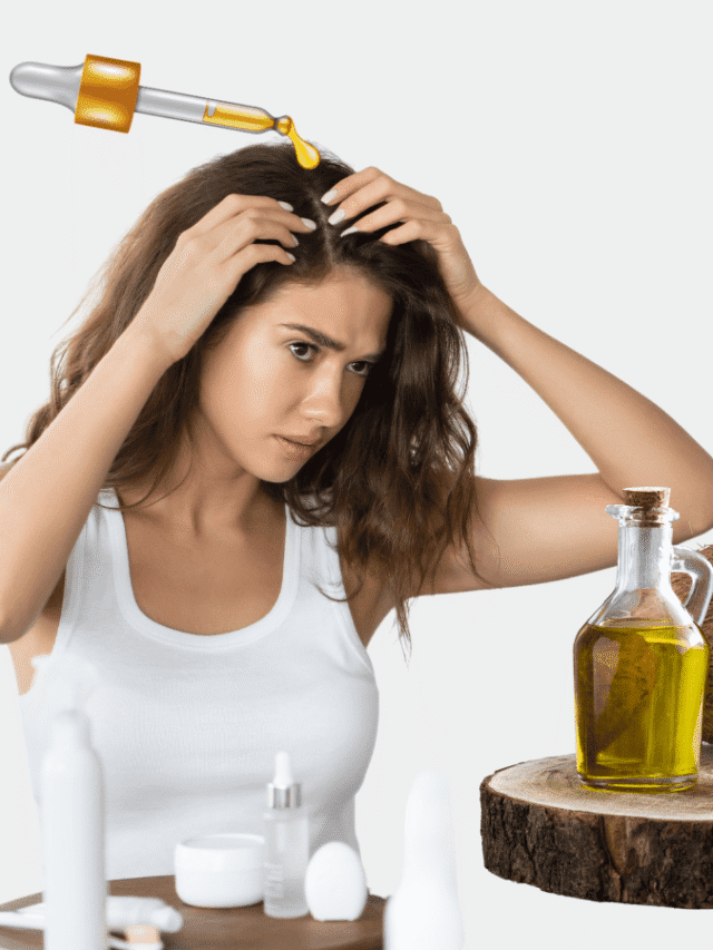 Coconut oil being applied to scalp with large dandruff flake.